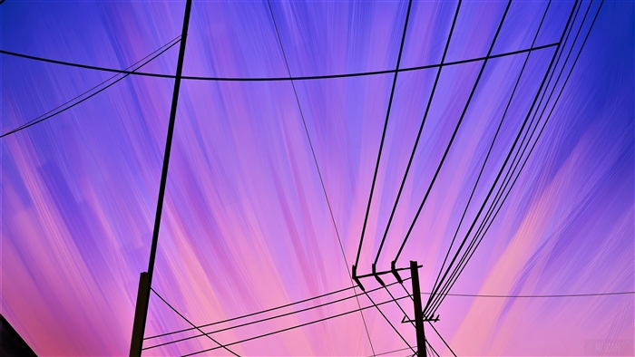 Powerlines against a purple and pink sky 4K
