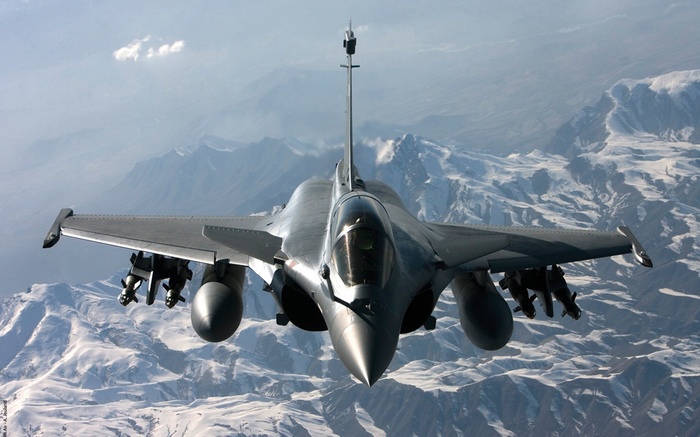 Dassault Rafale fighter jet flying over mountains