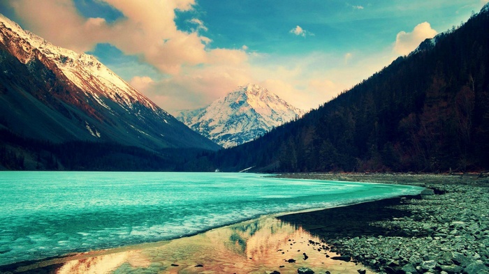 Turquoise lake and snow-capped mountains landscape 4K