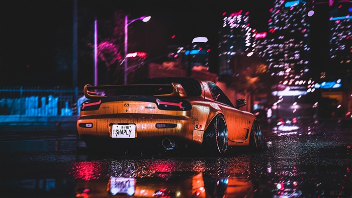 Mazda RX-7 in a rainy city at night