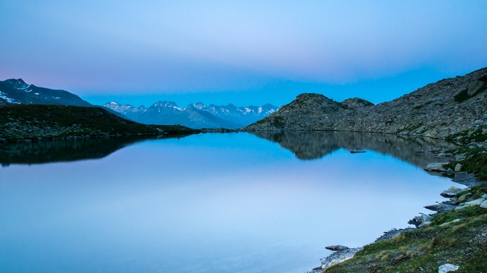 Mountain lake at twilight with reflections