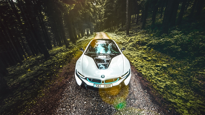 White BMW i8 2020 on a forest road 4K