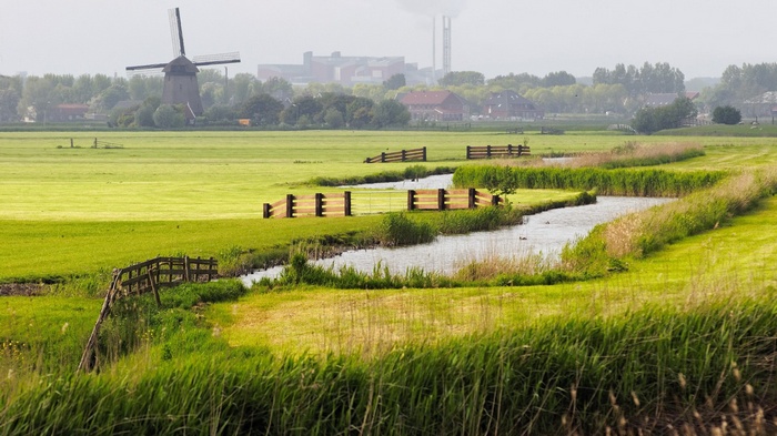Windmill and canal in a Dutch landscape