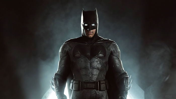 Batman in his suit with glowing eyes