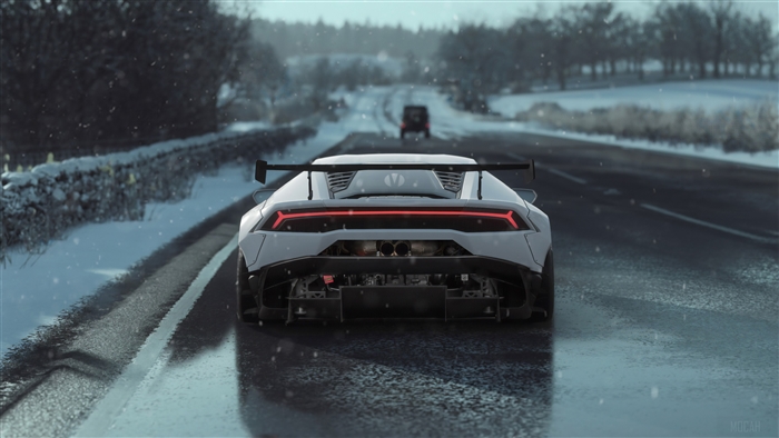 Lamborghini Huracan driving on a snowy road