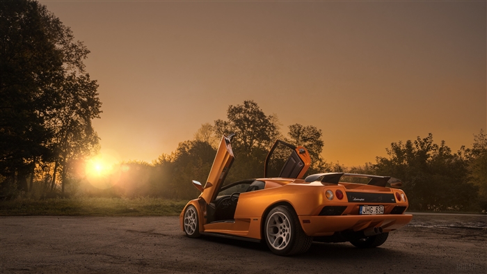 Orange Lamborghini Diablo VT Convertible at Sunset