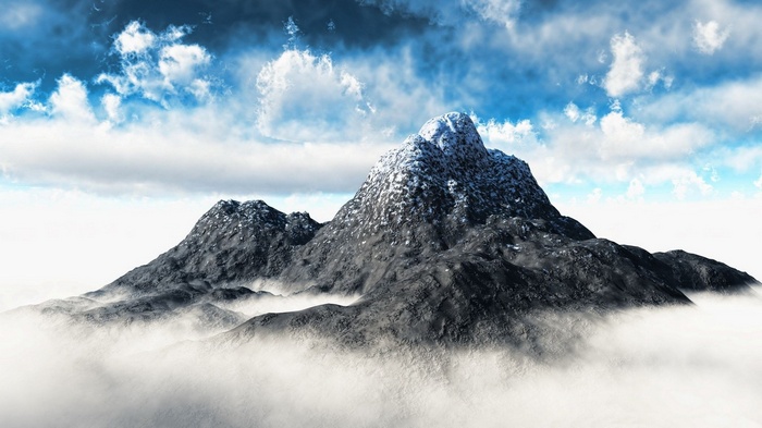 Snow-capped mountain peak above clouds