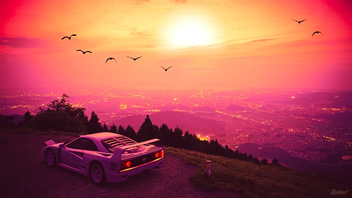 Ferrari F40 on a mountain overlooking a city at sunset