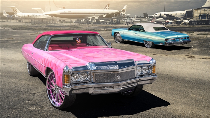 Pink and Blue Classic Chevrolet Lowriders at Airport