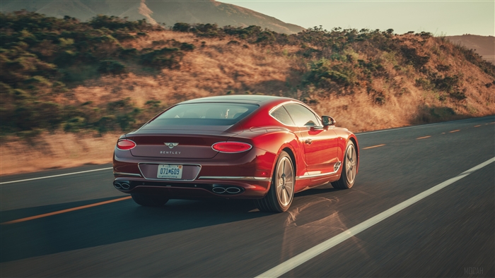 Red 2020 Bentley Continental GT V8 driving on road