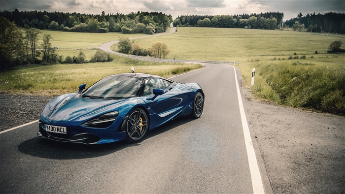 Blue McLaren 720S on a winding road