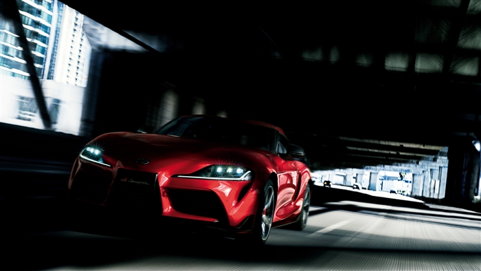 Red Toyota GR Supra driving through tunnel 4K