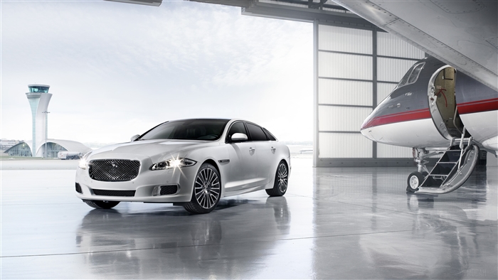 Jaguar XJ Ultimate 4K in hangar with private jet