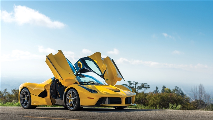 Yellow Ferrari LaFerrari with doors open