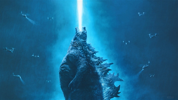 Godzilla firing atomic breath surrounded by drones