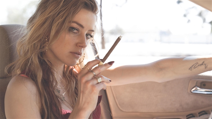 Amber Heard in car with cigarette