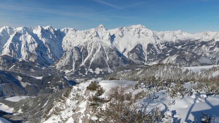 Snow-covered mountains under a clear blue sky