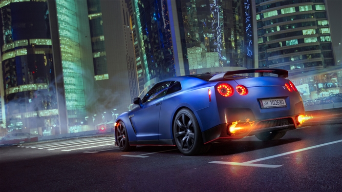 Blue Nissan GTR with flames from exhaust 4K