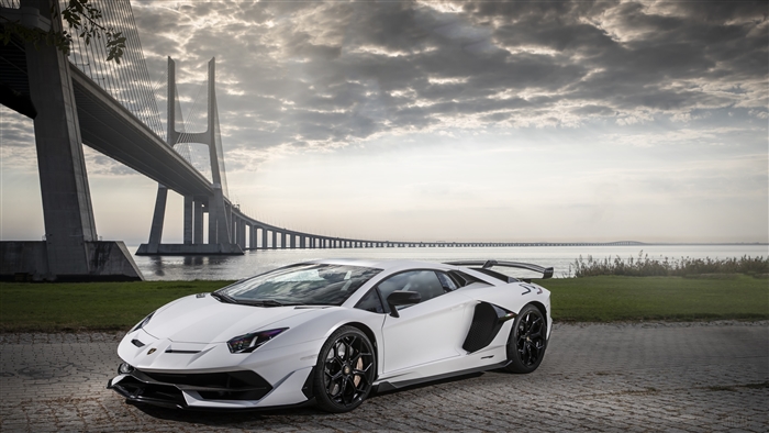 White Lamborghini Aventador SVJ 4K near Vasco da Gama Bridge