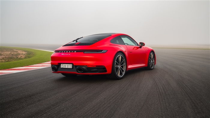 Red Porsche 911 Carrera on a Racetrack