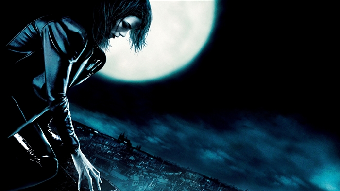 Selene from Underworld in front of a full moon