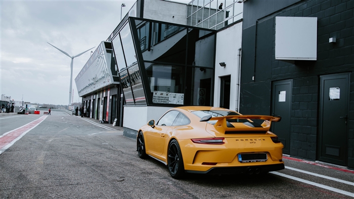 Yellow Porsche GT3 on a Race Track