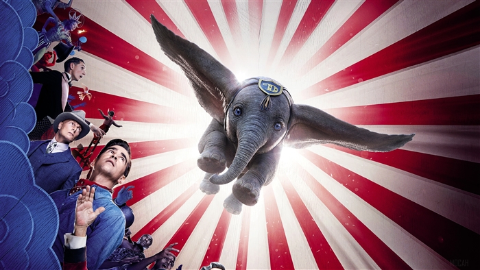 Dumbo flying in front of circus tent