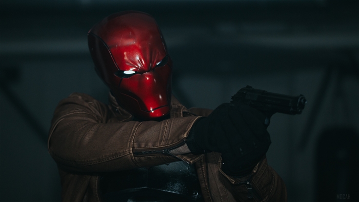Red Hood aiming a gun