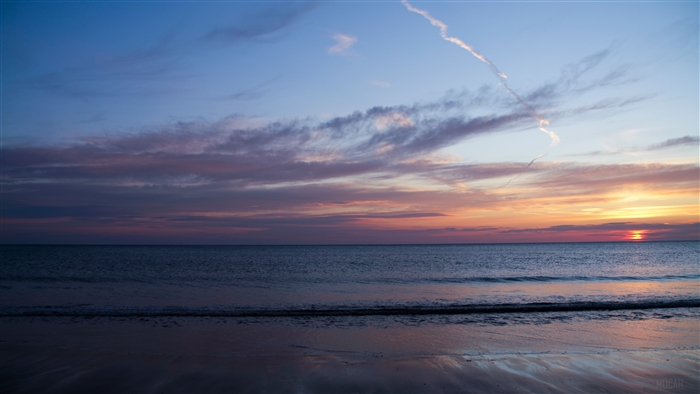Blue Hour Sunset Over Ocean and Beach 4K