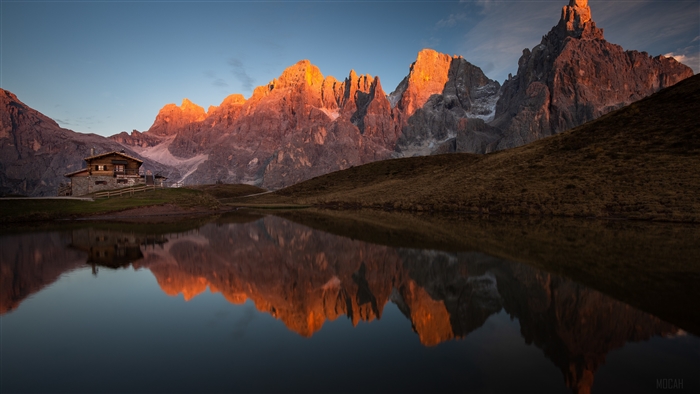 Mountain Cabin Reflected in Lake at Sunrise