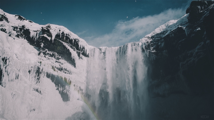 Waterfall in Iceland with Snow and Blue Sky 4K