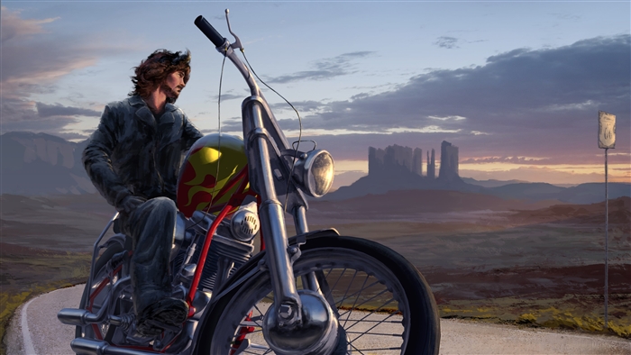Man riding a motorcycle in the desert at sunset