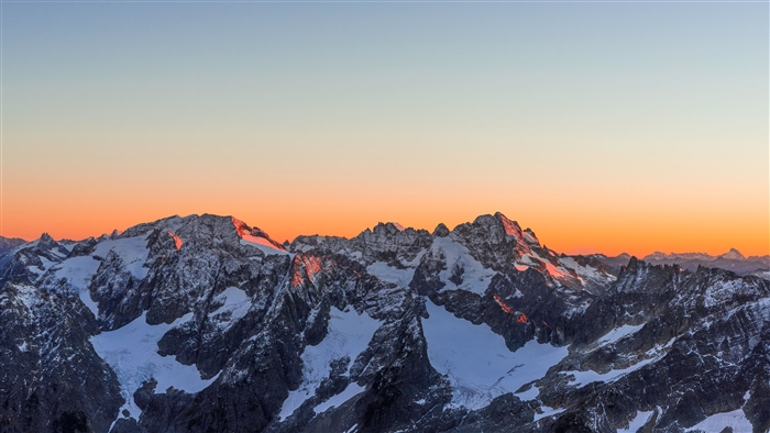 Sunset Over Snow-Covered Mountains 4K