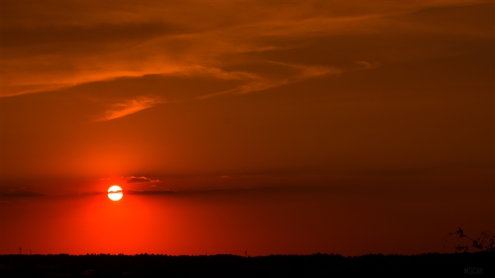 Sunset over a dark landscape