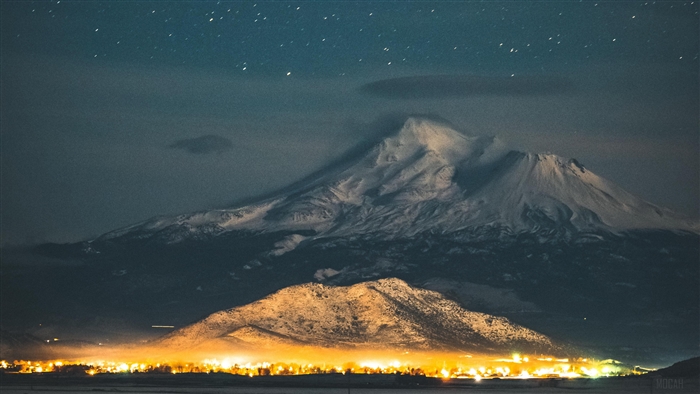 Mount Shasta at night with city lights