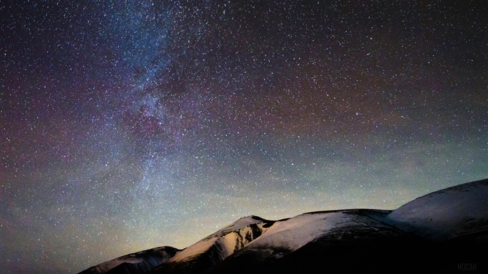 Milky Way Over Snow-Capped Mountains