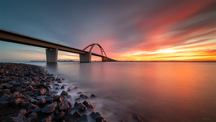 Bridge over water at sunset 4K