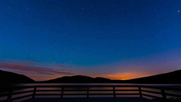 Starry Night over Lake with Mountains and Dock