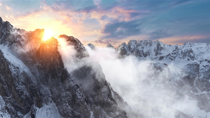 Sunrise over snow-covered Dolomites mountains
