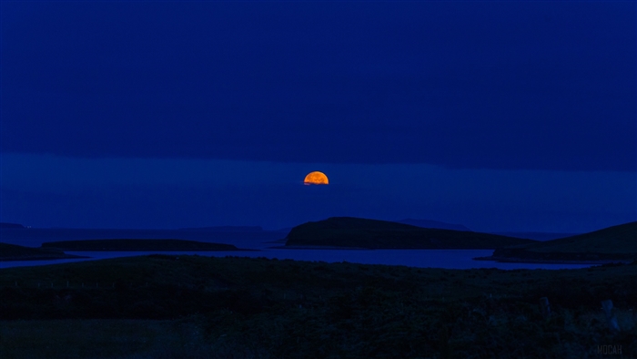 Orange Moon Over Water and Islands