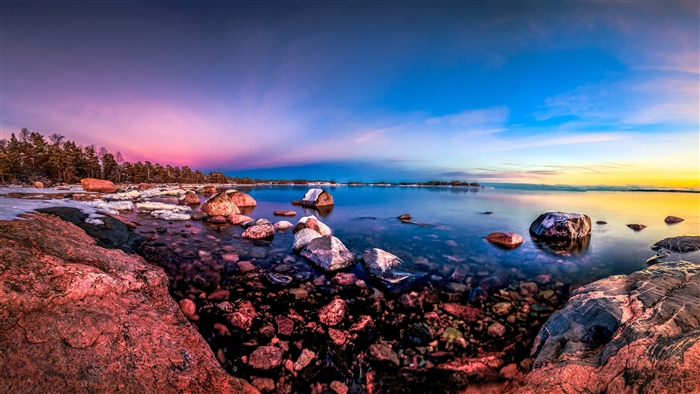 Rocky Shoreline at Sunset with Colorful Sky