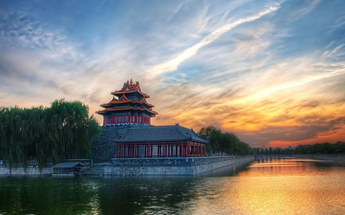 Watchtower by the water at sunset