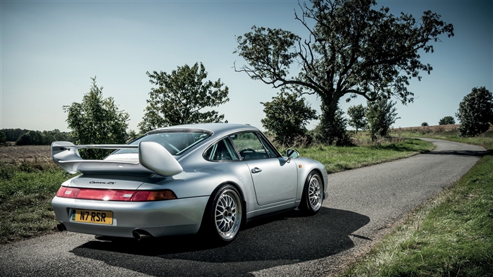 Silver Porsche 911 Carrera RS on a Country Road