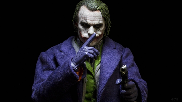 Joker from Batman holding a gun