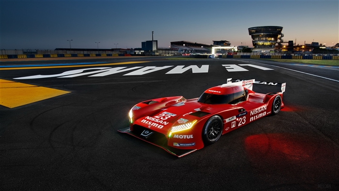Red Nissan GT-R Nismo race car on Le Mans track