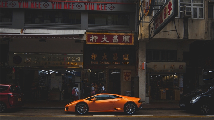 Orange Lamborghini parked in Hong Kong