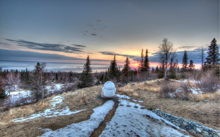 Observatory dome on a hill at sunset
