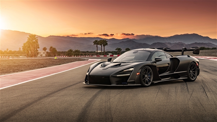 Black McLaren Senna on a race track at sunset