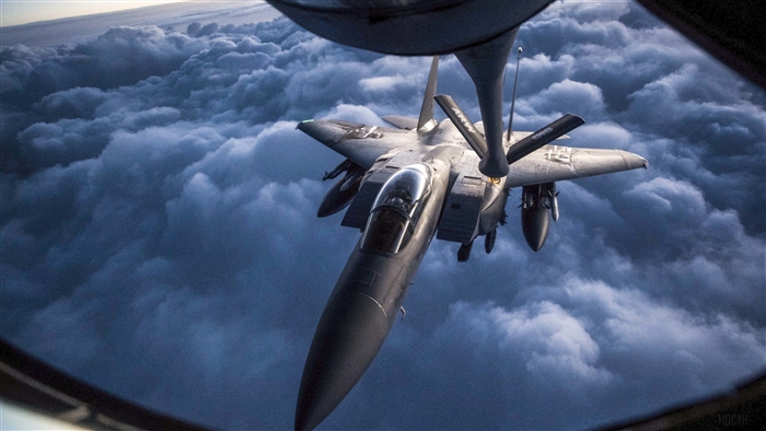 McDonnell Douglas F-15 Eagle refueling in clouds 4K