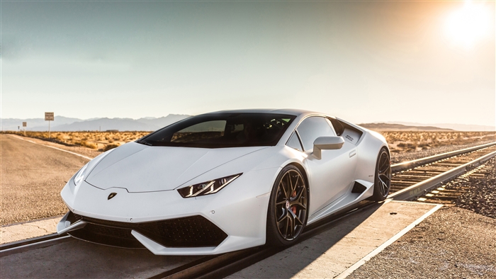 White Lamborghini Huracan on Railroad Tracks